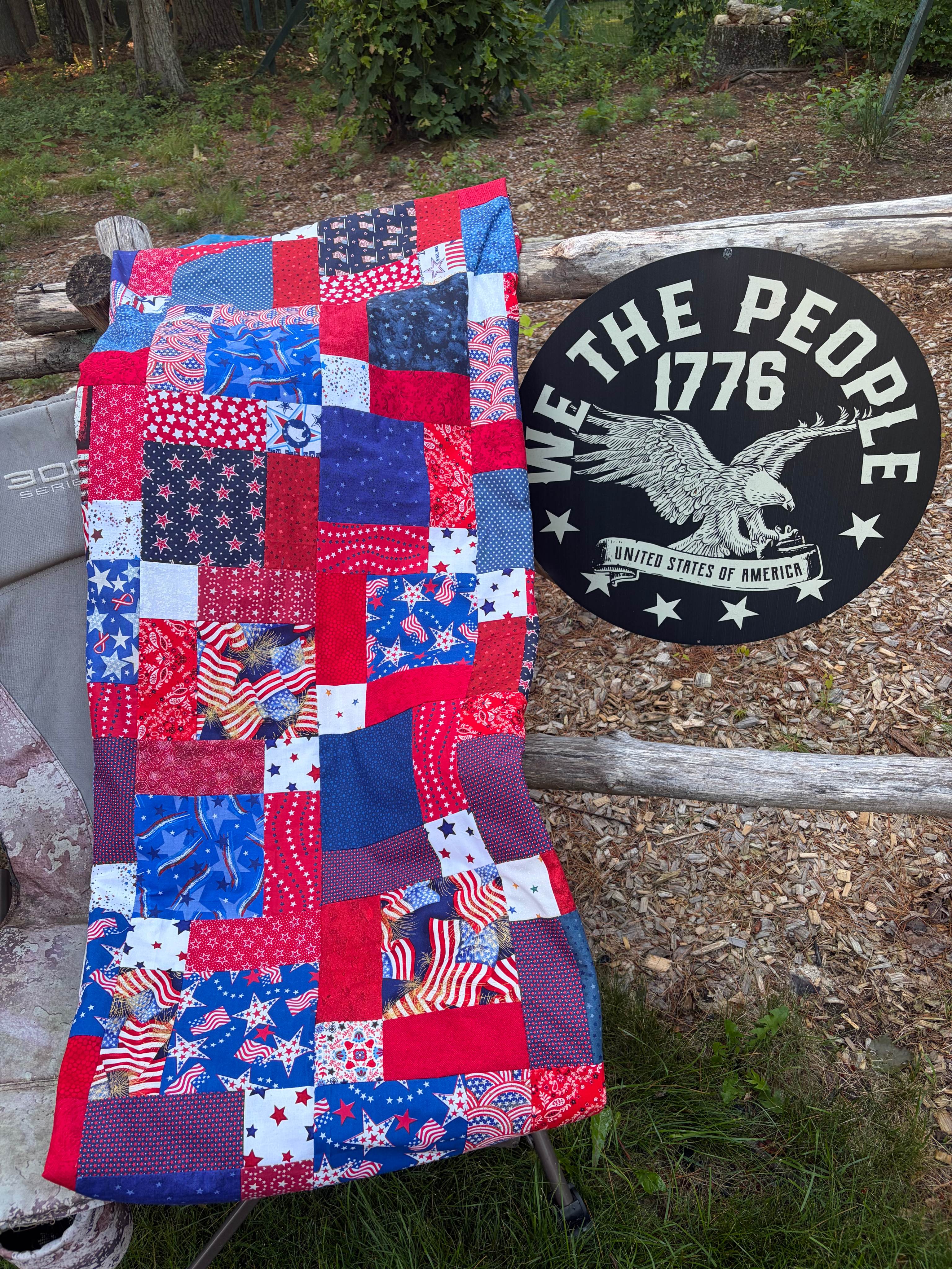 Patriotic quilt displayed outdoors