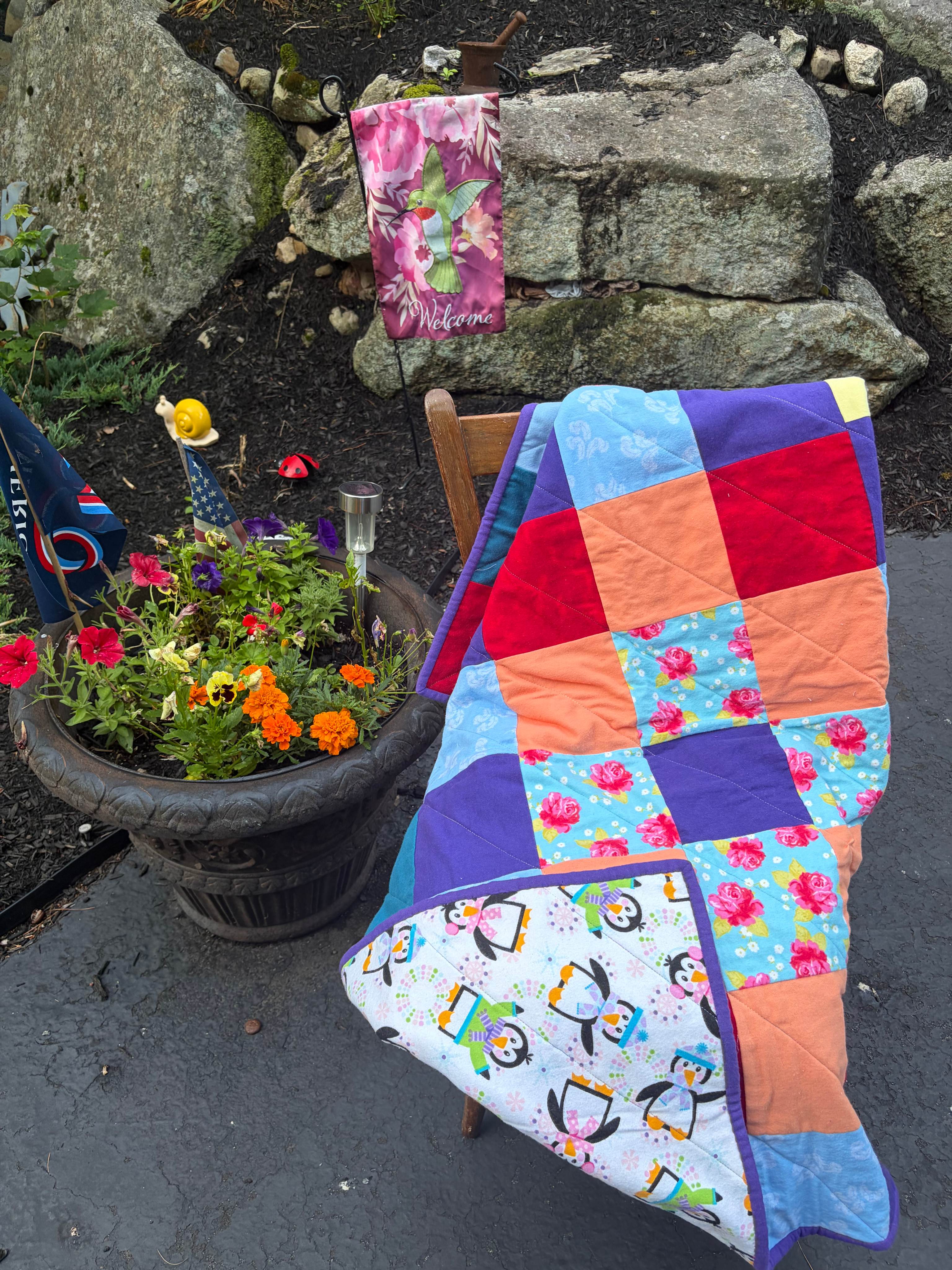 Quilts displayed in a garden